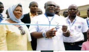 General Overseer, Omega Power Ministries, Apostle Chibuzor Chinyere (middle), cutting the tape to officially commission the Church’s free nursery and primary school buildings at the OPM headquarters in Port Harcourt. With him are Pastor Godwin Ozoemelam (right), Director of Welfare, Mrs Maureen Chikwu  and others, yesterday.