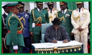 President Goodluck Jonathan, signing the anniversary register, during the Presidential Change of Guards Parade, at the Presidential Villa in Abuja, yesterday