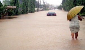 Submerged escort vehicle on Ihama Road, GRA, Benin City after a down pour.