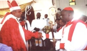 Newly consecrated Bishop of Opobo Diocese of Christ Army Communion Mission, Venerable Festus Oko-Jaja (right) in a handshake with the Archibishop of the Diocese, Dr. I. T. S. Anyanasikike, during the consecration in Port Harcourt, recently.