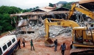 A building  being demolished on Zik Avenue in Enugu, recently. Photo: NAN