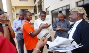 Counsel to sacked workers of non-consolidated Banks of Nigeria, Mr Emenike Azubuike (R), briefing newsmen after hearing of the case at National Industrial Court in Enugu recently.