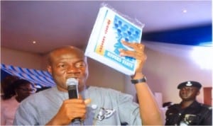 Chief of Staff of Rivers State Government House, and chairman of the occasion, Sir Tony Okocha, unveiling the book.