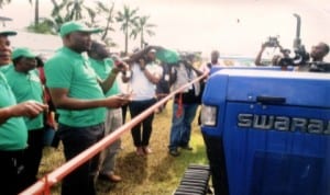 Rivers State Commissioner for Agriculture, Hon Emmanuel Chindah (left), commissioning a tractor donated by NDDC to Rivers State Government, during the 2013 World Food Day celebration in Port Harcourt recently. 