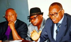 L-R: Chairman, Penticostal Fellowship of Nigeria, Enugu State, Bishop Obi Onubogu, Deputy Director, Sss, Enugu, Mr Arikpo Eyong and Director, Mr Victor Duru, at a news conference on alleged self-proclaimed Boko Haram member in Enugu , yesterday. Photo: NAN