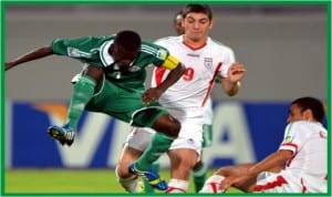 Golden Eaglets captain, Musa Yahaya (left) in action against Iran, yesterday. 