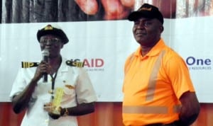 Representative of Nigerian Navy Medical Centre, Lt.- Commodore Esther Bitrus (left), displaying the award she won on behalf of the Navy, at the 2nd National Healthcare Waste Summit in Lagos last Tuesday.  With her is Managing Director, Lagos State Waste Management Authority, Mr Ola Oresanya,