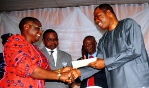 L-R: Representative of Vice President, Mrs Anastasna Daniel-Nwoba, Chairman, Transition Committee, Bureau of Public Enterprises, Mr Olatunde Ikuerowo, Managing Director, Ibadan Oyesiku and Vice Chairman , Integrated Energy Distribution and Marketing, Mr Olatunde Ayeni, at the hand over of Ibadan  Distribution Company to Integrated Energy Distribution and Marketing Company in Ibadan last Friday.