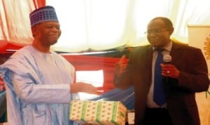 President, Lagos State Chamber of Commerce and Industry, Mr Goodie Ibru (left), with the representative of the Managing Director, Nigerian National Petroleum Corporation (NNPC), Mr Isyaku Abdulahi, during  NNPC  day, at the ongoing Lagos International Trade Fair in Lagos, yesterday.