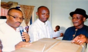 General Manager,  Rivers State Newspaper Corporation, Mr Celestine Ogolo (left), presenting a sovenier to former Director of Administration, RSNC, Mr Alfred Nworgu (right), during a send forth party organised in honour of the former Director by Ogbakor Ikwerre, The Tide Chapel, yesterday.  With them is Secretary of the body Mr Abraham Amesi 