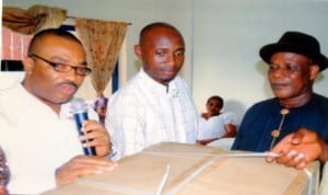 General Manager, Rivers State Newspaper Corporation, Mr Celestine Ogolo (left), presenting a sovenier to former Director of Administration, RSNC, Mr Alfred Nworgu (right), during a send forth party organised in honour of the former Director by Ogbakor Ikwerre, The Tide Chapel, yesterday. With them is Secretary of the body Mr Abraham Amesi