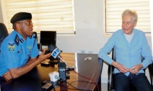 Kaduna State Commissioner of Police, Mr Olufemi Adenaike (left),with a rescued kidnapped staff of Vanax Company of France, Mr Francis Collon, at a news conference in Kaduna, yesterday. Photo: NAN