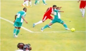 Super Eagles player (right), outsmarting an opponent, during one of the FIFA 2014 World Cup qualifiers in Calabar, Cross River State