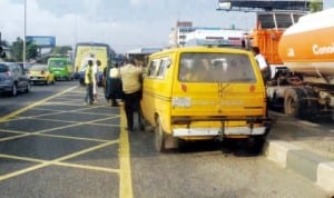 A Lagos State Transport Management Authority (lastma) official arresting an erring commercial driver at Iponri Area of Lagos, recently. Photo: NAN