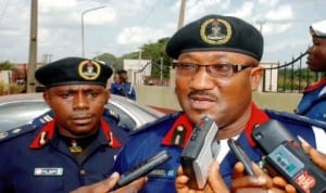 Deputy Commandant, Nigeria Security and Civil Defence Corps, Enugu Command, Mr. Dan Samuel (left), with his Commandant, Mr. Nathaniel Ubong, addressing newsmen on armed robbery suspects paraded by the command in Enugu, recently. Photo: NAN