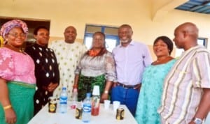 Advert Manager, Lagos office of The Tide Newspapers, Mrs. Myne Dickson (middle), with staff of RSNC and other guests,  at the dedication of her grand child in Port Harcourt last Sunday. Photo: Chris Manyanaga