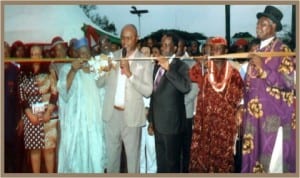 Representative of the Rivers State Governor and Commissioner for Commerce and Industry, Hon. Chuma Chinye (middle),  cutting the tape during the opening of the 9th Port Harcourt International Trade Fair in Port Harcourt last Friday. With him are National President, NACCIMA, Alhaji Mohammed Badaru Abubakar (2nd left), HRM Alfred Diete-Spiff (right) and other dignitaries.   Photo: Egberi A. Sampson