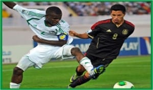 Kelechi Iheanacho (left) being pulled down by an opponent during one of the matches in the just-concluded U-17 World Cup