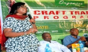 Representative of the Director-General, Nigeria Tourism Development Corporation (NTDC), Mrs Patricia Ewuzie (left), addressing participants during a crafts training programme in Degema, Rivers State last Monday. With her are organiser of the programme and member, representing Degema/Bonny Federal Constituency in the National Assembly, Dr Sokonte Davies (right) and representative of Chairman, Degema LGA., Mr Ambille Belema