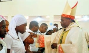 Catholic Bishop of Bauchi Diocese, Most Rev. Malachy John-Goltok, performing Confirmation on some Catholics at the St. Theresa’s Catholic Church, Tumfure, Gombe, yesterday.