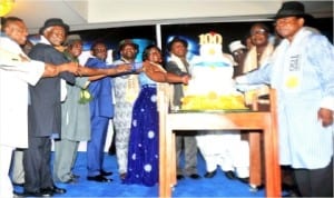 Rivers State Governor, Rt. Hon. Chibuike Rotimi Amaechi (middle), with other dignitaries cutting the Port Harcourt City Centenary Celebration Cake during an Award Night in Port Harcourt , last Saturday. 