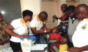 Garden City Lions Club, Port Harcourt immunising children against Measles