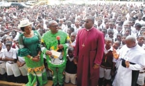 Governor Peter Obi of Anambra State (2nd left) , about to present a cheque of N10m to Bishop of the Diocese of the Niger, Bishop Owen Nwokolo (3rd left), during the visit of a World Bank team to Dennis Memorial Grammar School (DMGS), in Onitsha, recently.