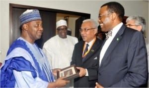 Vice President Namadi Sambo (left), receiving a souvenir from the Secretary-General, Ministry of Agriculture and Agro-Based Industry, Malaysia, Mohammed Abdullahi, during a courtesy call on the Vice President by ministers of agriculture of D-8 countries in Abuja last Friday. With them are, Minister of Agriculture, Dr Akinwunmi Adesina (right) and Deputy Chief of Staff to Vice President , Alhaji Abubakar Kachalla.