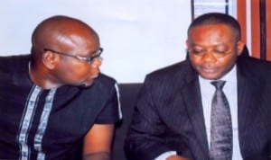 Chairman, Tarakiri Cluster Development Board, Dr Jude Ebibokefie (left), with Genetal Manager, SOCR, Shell Petroleum Development Comany of Nigeria Limited, Mr Nedo Osanyamre, during the commissioning of Agbidiama landing craft at SPDC Marine Base, Kidney Island, Port Harcourt, recently. Photo: Egberi. A. Sampson