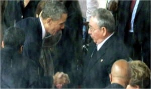 President Barack Obama (left) shakes hands with Cuban President, Raul Castro, during the official Memorial Service for former South African President, Nelson Mandela at FNB Stadium in Johannesburg, South Africa, yesterday.