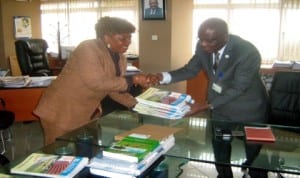 Rivers State Head of Service,  Barr.  Samuel LongJohn (right), receiving some copies of the Rivers Bureaucrat from Chairman, Editorial Board and Permanent Secretary, Ministry of Commerce and Industry, Ms Kadilo Brown in Port Harcourt, recently.