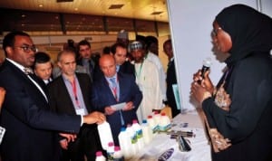 Executive Director, Sales and Marketing, L&Z Integrated Farms Ltd, Zubaida Abubakar (right), explaining the company’s products to the Minister of Agriculture, Dr Akinwumi Adesina (left), and other delegates of D8 Organisation for Economic Cooperation, at the 4th D8 Agricultural Ministerial Meeting on Food Security in Abuja, recently