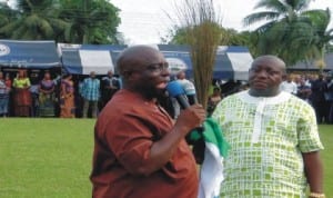 Rivers State Commissioner for Works, Victor Giadom (left), flanked by former Gokana Council Chief of Staff, Second Bakor with APC flag and broom, addressing Gokana people at a rally in Kpor, recently.