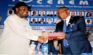 Representative of Minister of Petroleum Resources, Engr. Ernest Nwakpa (left), receiving an award from Vice Chancellor of the University of Port Harcourt, Prof. Joseph Ajienka, during an induction /anniversary ceremony organised by Institute of Petroleum Studies  of the university, in Port Harcourt, recently    Photo: Obinna Prince Dele