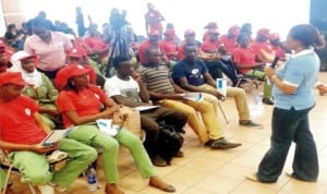 Programme Analyst, United Nations Population Fund (UNFPA), Tochie Odele (right), addressing youths during a Town Hall meeting in Abuja recently.