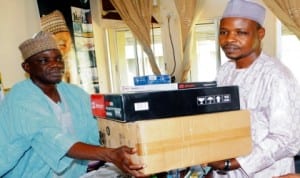 Chairman, Nuj, Bauchi State Council, Comrade Dahiru Mohammed (right), presenting a set of computer to the State Commissioner for Information, Alhaji Mohammed Dhamina, in Bauchi, recently. Photo: NAN