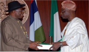 Chairman, Presidential Advisory Committee on National Conference, Dr Femi Okuronmu (right), presenting the report of the committee to President Goodluck Jonathan at the Presidential Villa in Abuja last Wednesday