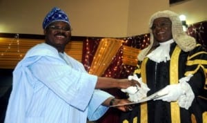 Governor  Abiola Ajimobi of Oyo State (left), presenting 2014 Budget to the Speaker of Oyo State House of Assembly, Mrs Monsurat Sunmonu, in Ibadan last Thursday.