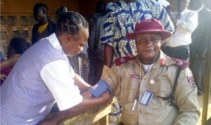 Unit Commander, FRSC Ogere Unit, Mr Godwin Sangbasa, being screened during health screening for drivers at Ilishan-remo Motor Park, Ogun, during  the ember months campaign last Thursday.