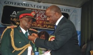 Governor Chibuike Amaechi decorating King (Col) Philemon Chindah Omunakwe (rtd) Chairman Nigerian Legion, Rivers State, during the 2014 Armed Forces Emblem Appeal Launching in Port Harcourt, last Tuesday.