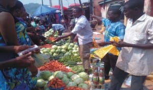 Shoppers buying vegetables at the popular “Oja-Oba” located at the heart of Ado-Ekiti, during their last-minute preparations for New Year celebrtions last Monday