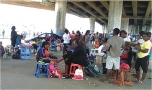 Beauticians at work in preparation for New Year at Mile 1 in Port Harcourt, recently.