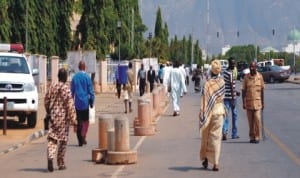 Workers resuming from New Year holiday at the Federal Secretariat in Abuja, yesterday.