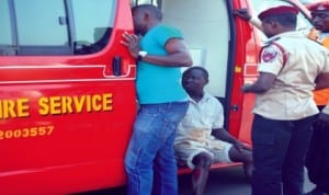 A medical team attending to an injured man during a stampede resulting from a fuel tanker that caught fire at the Nnpc Mega Station on Olusegun Obasanjo Way, Central Business District in Abuja recently. Photo: NAN