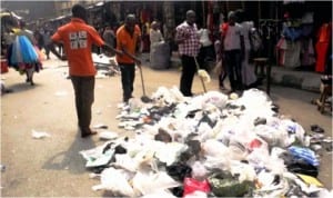 Cleaning of Balogun Market after the Christmas and New Year celebration In Lagos On Friday