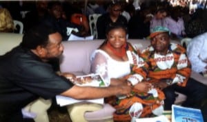 Former member, Old Rivers State House of Assembly, Chief (Hon) D.K. Baadom (left) in a hand shake with the President of MOSOP, Mr Legborsi Pyagbara (right) and his wife, Mrs Legborsi at the 21st Ogoni Day anniversary at Bori last Saturday.