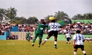 Home-based Super Eagles player in aerial contest with a Gokana United FC opponent during one of the Eagles’ friendly matches with the amateur league side at the Gokana Central Stadium ahead of the 2014 CHAN Tournament. Photo: Chris Monyamaga