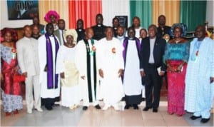 President Goodluck Jonathan (5th right), President, Church of Christ in Nations, Garki Abuja, Rev. Dachollom Datiri (5th left), Chaplain, Aso Villa Chapel, Ven. Obioma Onwuzurumba (3rd right), Chief of Staff, Chief Mike Oghiadomhe (right) and others after the 1st Sunday of the Year Church Service at Church of Christ in Nations (COCIN), Area 1 Garki Abuja, yesterday.