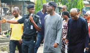 Chairman, Lagos State Taskforce on Environment, ASP Bayo Sulaiman (2nd left), Governor Babatunde Fashola  of Lagos State (2nd right) and Commissioner for Information and Strategy, Mr Lateef  Ibirogba, (right), during an  inspection of Mosafejo Market in Lagos by Governor Fashola recently.