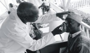 From Left: Assistant Chief Nursing Superintendent, Abubakar Tafawa Balewa Teaching  Hospital (Atbuth) in Bauchi, Saleh Sani, examining an eye patient, Malam Umaru Dahiru, during Operation Goodluck  Restore Eye Sight at Atbuth in Bauchi last Monday. Photo: NAN